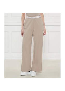 EA7 Spodnie dresowe | flare fit ze sklepu Gomez Fashion Store w kategorii Spodnie damskie - zdjęcie 185001754