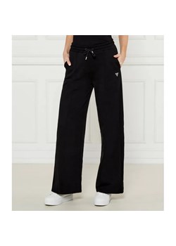 GUESS ACTIVE Spodnie dresowe PRIMULA | flare fit ze sklepu Gomez Fashion Store w kategorii Spodnie damskie - zdjęcie 185005451