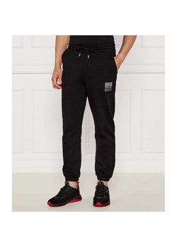 HUGO Spodnie dresowe Dusplitan | Loose fit ze sklepu Gomez Fashion Store w kategorii Spodnie męskie - zdjęcie 185011073