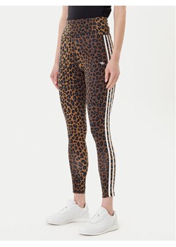 adidas Legginsy Leopard 3-Stripes JW7308 Brązowy Slim Fit ze sklepu MODIVO w kategorii Spodnie damskie - zdjęcie 185040800