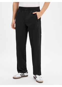 adidas Originals Męskie spodnie dresowe - Firebird Mężczyźni czarny jednolity ze sklepu vangraaf w kategorii Spodnie męskie - zdjęcie 185362763