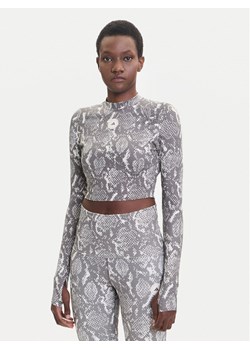 adidas by Stella McCartney Koszulka techniczna Training JM8478 Beżowy Slim Fit ze sklepu MODIVO w kategorii Bluzki damskie - zdjęcie 185371751