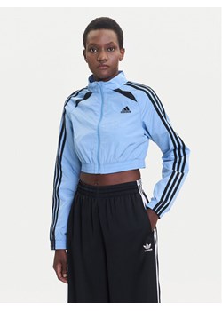 adidas Bluza Teamgeist adicolor JZ8277 Błękitny Slim Fit ze sklepu MODIVO w kategorii Bluzy damskie - zdjęcie 185371761