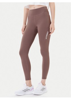 adidas Legginsy Terrex Multi JM0422 Brązowy Slim Fit ze sklepu MODIVO w kategorii Spodnie damskie - zdjęcie 185391261