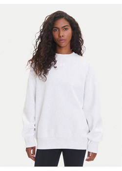 Under Armour Bluza Ua Rival 1386463 Biały Oversize ze sklepu MODIVO w kategorii Bluzy damskie - zdjęcie 185411902