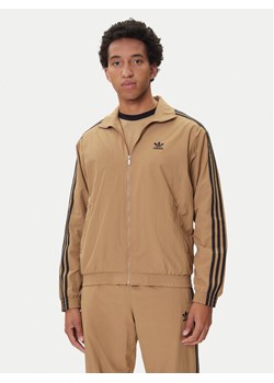 adidas Bluza adicolor Woven Firebird JY1333 Beżowy Loose Fit ze sklepu MODIVO w kategorii Bluzy męskie - zdjęcie 185411913