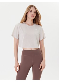 adidas Koszulka techniczna Train Essentials JE6169 Beżowy Loose Fit ze sklepu MODIVO w kategorii Bluzki damskie - zdjęcie 185415951