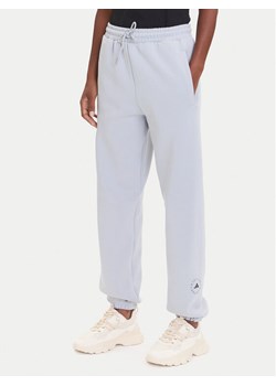 adidas by Stella McCartney Spodnie dresowe JX6777 Szary Loose Fit ze sklepu MODIVO w kategorii Spodnie damskie - zdjęcie 185416044