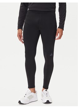 adidas Legginsy Own The Run Winterized JN9597 Czarny Slim Fit ze sklepu MODIVO w kategorii Spodnie męskie - zdjęcie 185416053