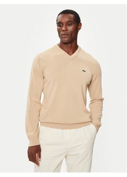 Lacoste Sweter AH1951 Beżowy Regular Fit ze sklepu MODIVO w kategorii Swetry męskie - zdjęcie 185517294