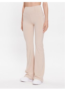 Guess Spodnie materiałowe Brigit V3GB03 MC04Z Beżowy Slim Fit ze sklepu MODIVO w kategorii Spodnie damskie - zdjęcie 185583602