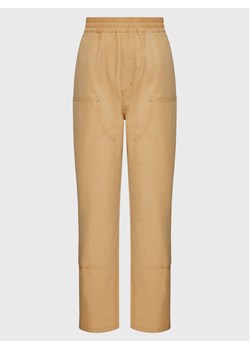 Carhartt WIP Spodnie materiałowe Unisex Montana I030622 Beżowy Regular Fit ze sklepu MODIVO w kategorii Spodnie damskie - zdjęcie 185602983