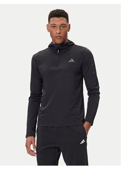 adidas Bluza techniczna Own The Run Winterized JN6378 Czarny Slim Fit ze sklepu MODIVO w kategorii Bluzy męskie - zdjęcie 185635114