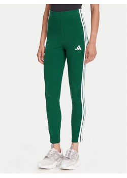adidas Legginsy Essentials 3-Stripes KB7663 Zielony Slim Fit ze sklepu MODIVO w kategorii Spodnie damskie - zdjęcie 185713694