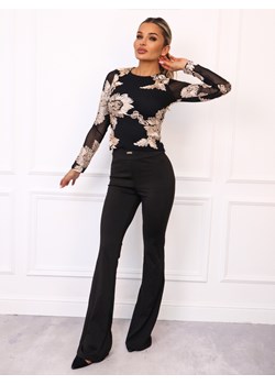 LEGGINSY FLARE Z ROZSZERZANYMI NOGAWKAMI I NASZYWKĄ- CZARNY ze sklepu olika.com.pl w kategorii Spodnie damskie - zdjęcie 185715140