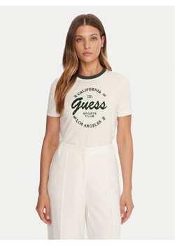 Guess T-Shirt V5BI03 J1314 Beżowy Slim Fit ze sklepu MODIVO w kategorii Bluzki damskie - zdjęcie 185737482