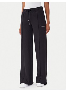 Guess Jeans Spodnie dresowe W5BB04 KC811 Czarny Wide Leg ze sklepu MODIVO w kategorii Spodnie damskie - zdjęcie 185737484
