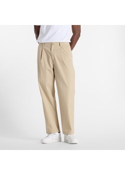Spodnie męskie New Balance MP51563SOT – beżowe ze sklepu New Balance Poland w kategorii Spodnie męskie - zdjęcie 185753294