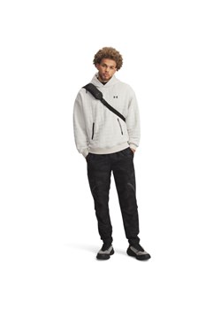 Męskie spodnie treningowe cargo UA Unstoppable Cargo Pant - czarne ze sklepu Sportstylestory.com w kategorii Spodnie męskie - zdjęcie 185755751