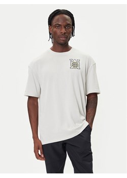 Under Armour T-Shirt Hoops Courtside 6003686 Biały Oversize ze sklepu MODIVO w kategorii T-shirty męskie - zdjęcie 185761141