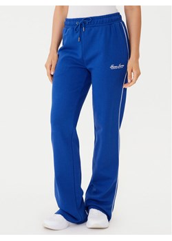 Guess Jeans Spodnie dresowe W5YB32 K68I4 Niebieski Regular Fit ze sklepu MODIVO w kategorii Spodnie damskie - zdjęcie 185783462