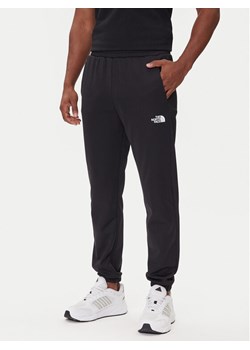 The North Face Spodnie dresowe Reaxion 2.0 NF0A8DRS Czarny Regular Fit ze sklepu MODIVO w kategorii Spodnie męskie - zdjęcie 185820522