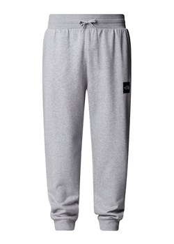 The North Face Spodnie dresowe Fine NF0A8C1K Szary Tapered Fit ze sklepu MODIVO w kategorii Spodnie męskie - zdjęcie 185833601