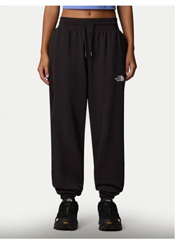 The North Face Spodnie dresowe Essential NF0A8C1G Czarny Relaxed Fit ze sklepu MODIVO w kategorii Spodnie damskie - zdjęcie 185834012