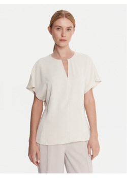 Calvin Klein Bluzka LV044C196G Écru Regular Fit ze sklepu MODIVO w kategorii Bluzki damskie - zdjęcie 185868623