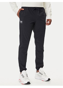 Under Armour Spodnie dresowe UA Vibe Woven 1386557 Czarny Regular Fit ze sklepu MODIVO w kategorii Spodnie męskie - zdjęcie 185913192