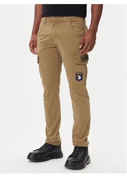Alpha Industries Spodnie materiałowe Petrol Patch 178207 Zielony Slim Fit ze sklepu MODIVO w kategorii Spodnie męskie - zdjęcie 185913333