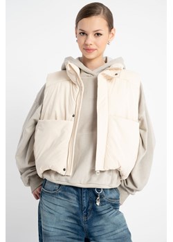 Kremowy bezrękawnik na stójce, kolor - kremowy, rozmiar - 140 ze sklepu REPORTER w kategorii Kamizelki dziewczęce - zdjęcie 185968641