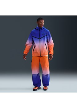 Męskie spodnie z tkaniny Nike Tech - Niebieski ze sklepu Nike poland w kategorii Spodnie męskie - zdjęcie 185994691