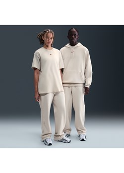 Spodnie dresowe o luźnym kroju u dołu Fleece CS NOCTA - Brązowy ze sklepu Nike poland w kategorii Spodnie męskie - zdjęcie 185994711