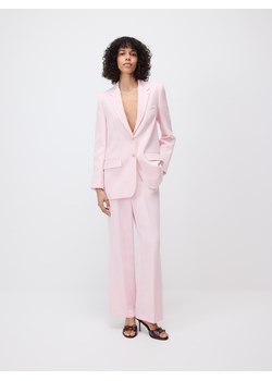 Reserved - Spodnie z lyocellem - pastelowy róż ze sklepu Reserved w kategorii Spodnie damskie - zdjęcie 185999922