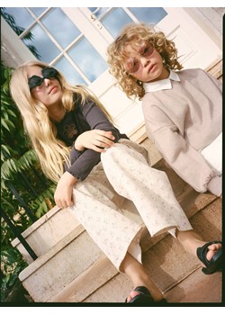 Reserved - Spodnie cargo w kwiaty - beżowy ze sklepu Reserved w kategorii Spodnie dziewczęce - zdjęcie 186011440