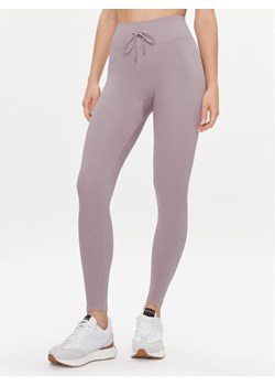 Guess Legginsy Rib-Seamless V4RB00 Z3CC0 Fioletowy Slim Fit ze sklepu MODIVO w kategorii Spodnie damskie - zdjęcie 186030240