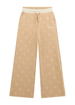 Guess Spodnie dresowe J5BQ17 K1902 Beżowy Wide Leg ze sklepu MODIVO w kategorii Spodnie dziewczęce - zdjęcie 186030413