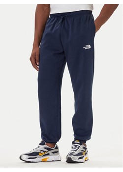 The North Face Spodnie dresowe Simple Dome NF0A8C1W Granatowy Regular Fit ze sklepu MODIVO w kategorii Spodnie męskie - zdjęcie 186031720