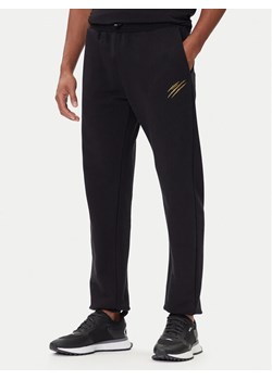 Plein Sport Spodnie dresowe PAEC MJT2607 STE003N Czarny Regular Fit ze sklepu MODIVO w kategorii Spodnie męskie - zdjęcie 186032110