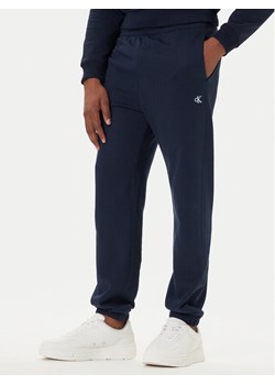 Calvin Klein Jeans Spodnie dresowe LV04RD241G Granatowy Regular Fit ze sklepu MODIVO w kategorii Spodnie męskie - zdjęcie 186033134