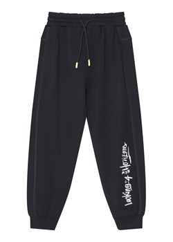 United Colors Of Benetton Spodnie dresowe 33NVCF06D Czarny Regular Fit ze sklepu MODIVO w kategorii Spodnie chłopięce - zdjęcie 186086852