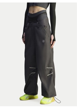 adidas by Stella McCartney Spodnie dresowe Woven JI5248 Czarny Loose Fit ze sklepu MODIVO w kategorii Spodnie damskie - zdjęcie 186136513