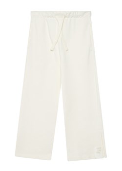 United Colors Of Benetton Spodnie dresowe 3NBMCF06K Écru Relaxed Fit ze sklepu MODIVO w kategorii Spodnie dziewczęce - zdjęcie 186140763
