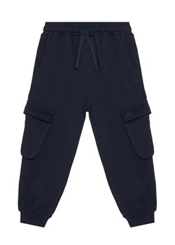 United Colors Of Benetton Spodnie dresowe 3J68CF06I Granatowy Regular Fit ze sklepu MODIVO w kategorii Spodnie chłopięce - zdjęcie 186151292