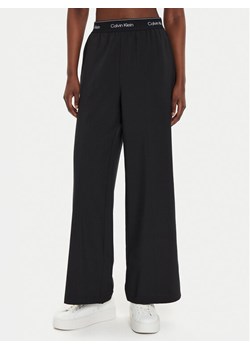 Calvin Klein Performance Spodnie dresowe 00GWF4P606 Czarny Wide Leg ze sklepu MODIVO w kategorii Spodnie damskie - zdjęcie 186200451