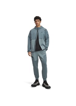 Męskie spodnie treningowe Under Armour UA Unstoppable Flc Jgr Eu - niebieskie ze sklepu Sportstylestory.com w kategorii Spodnie męskie - zdjęcie 186230123
