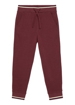 United Colors Of Benetton Spodnie dresowe 32N4CF06E Bordowy Regular Fit ze sklepu MODIVO w kategorii Spodnie dziewczęce - zdjęcie 186247830