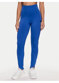 adidas Legginsy Z.N.E. IS3916 Niebieski Slim Fit ze sklepu MODIVO w kategorii Spodnie damskie - zdjęcie 186438502