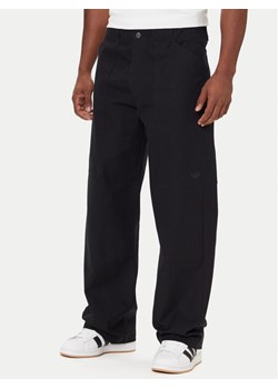 adidas Spodnie materiałowe Utility JY2770 Czarny Regular Fit ze sklepu MODIVO w kategorii Spodnie męskie - zdjęcie 186460710